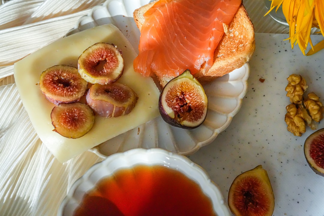 A rustic morning table with black tea, figs and walnuts