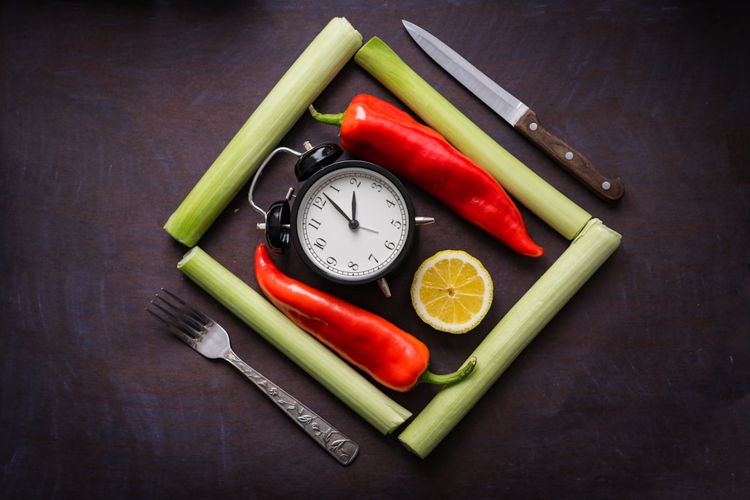 Fresh vegetables arranged around a clock